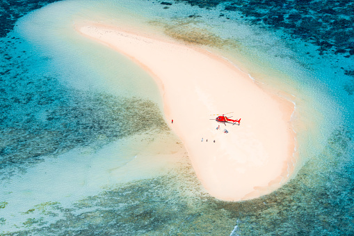 great barrier reef scenic flight aerial view of an helicopter on a white sand bank