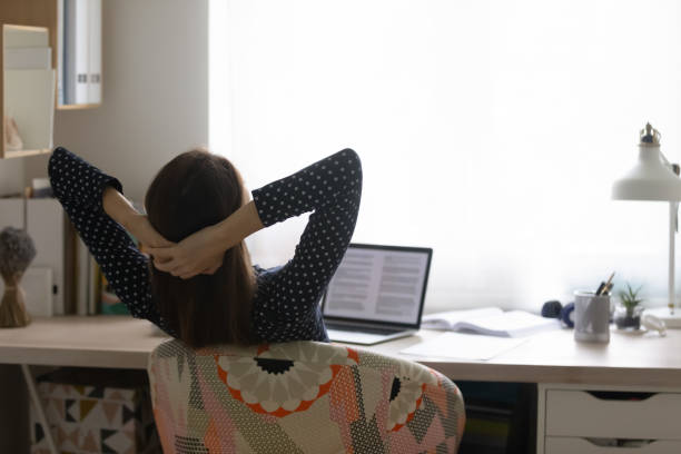 istock Distracted from distant study young woman relaxing at home. 1279977914