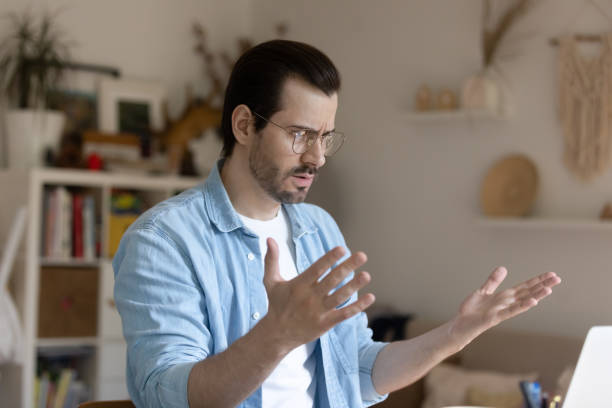 istock Confused young man feeling angry about received bad news. 1279978028