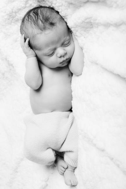 Newborn who sleeps peacefully stock photo