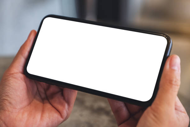 istock a woman holding mobile phone with blank white desktop screen 1279979484