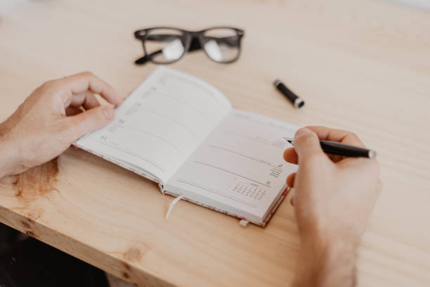 istock a man sitting at a desk plans the year 2021 1279979617