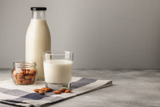 istock Almond milk with almond nuts in glass 1279980501