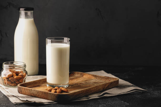 istock Almond milk with almond nuts in glass 1279980567