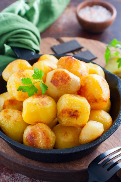 istock Whole potatoes fried in a pan, pushkin potatoes, selective focus 1279981142
