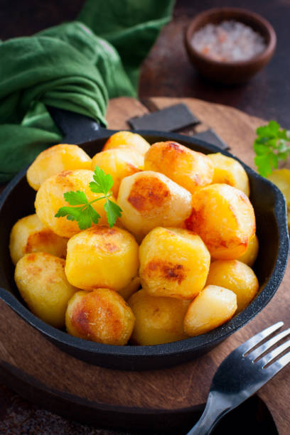 istock Whole potatoes fried in a pan, pushkin potatoes, selective focus 1279981159
