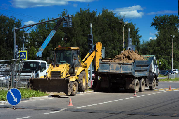 istock Road repairs with a tractor. 1279981618