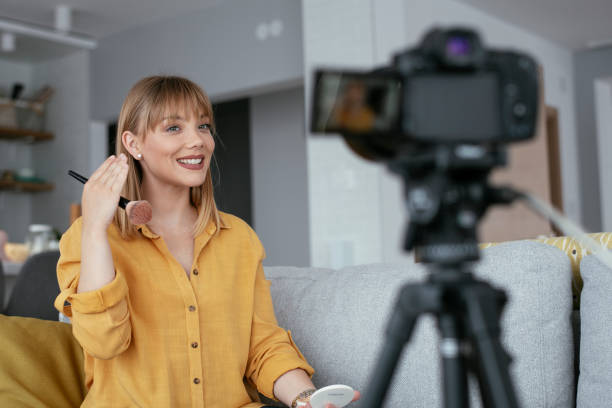 istock Young beautiful woman recording make up tutorial to share on social media. 1279982767