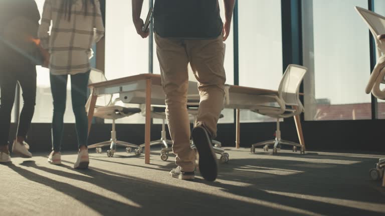 4k video footage of a group of young businesspeople having a meeting in a modern office