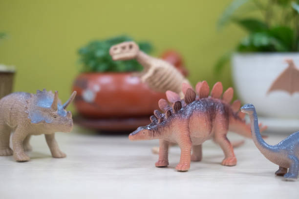istock Selective focus of a crowd gathered of toy plastic dinosaurs 1279984472