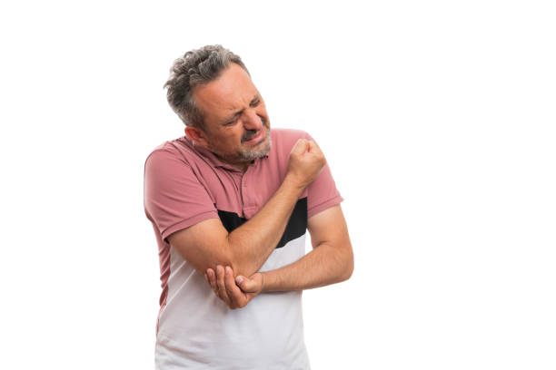istock Man in tshirt with hurting expression touching painful elbow 1279984473
