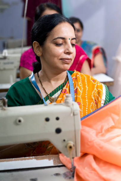 istock Indian woman textile worker on production line 1279987050