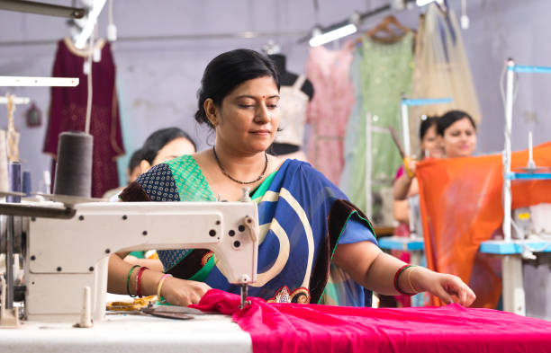 istock Indian woman textile worker on production line 1279987178