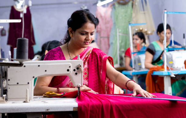 istock Indian woman textile worker on production line 1279987235