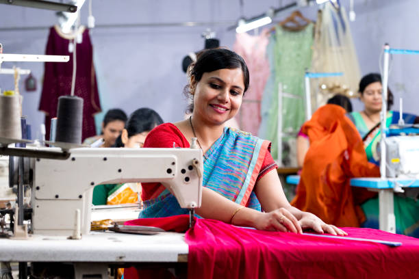istock Indian woman textile worker on production line 1279987321