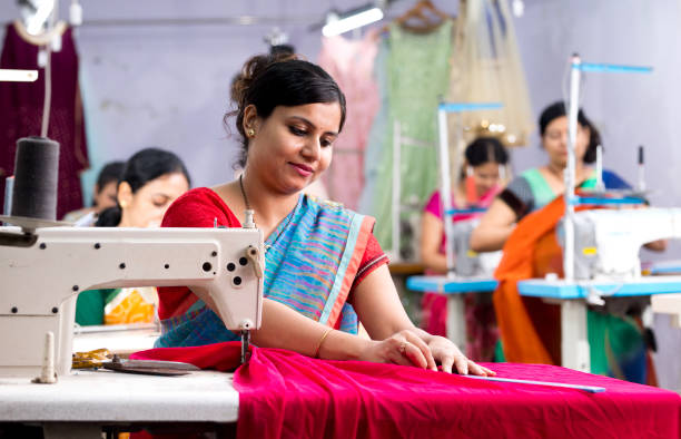 istock Indian woman textile worker on production line 1279987528