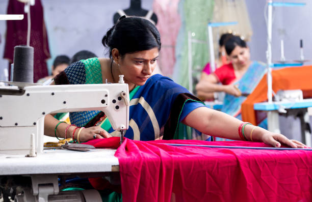 istock Indian woman textile worker on production line 1279988128