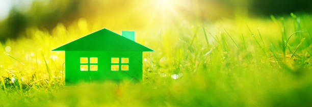 istock Green house on the fresh grass on a sunny day. 1279988609