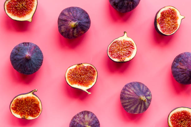 istock Pattern of whole and sliced figs. Overhead view 1279992631
