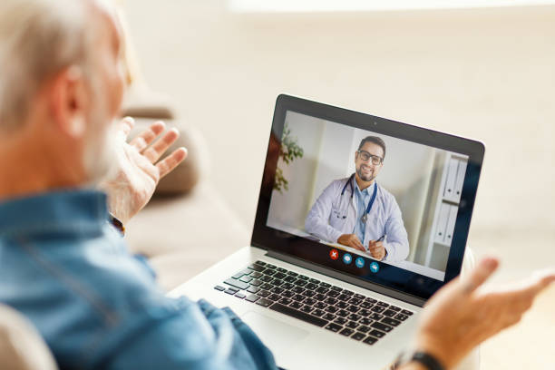 istock Senior man speaking with online doctor 1279993382