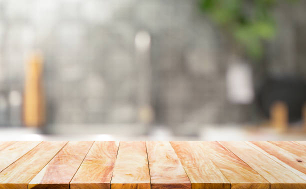 istock Wood table top on blur kitchen counter background 1279993407