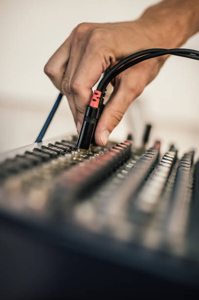 istock Behind the scene. Sound technician electric engineer adjusting sound elements 1279993493