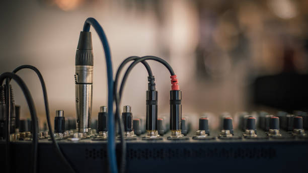 istock Behind the scene. Sound technician electric engineer adjusting sound elements 1279993635