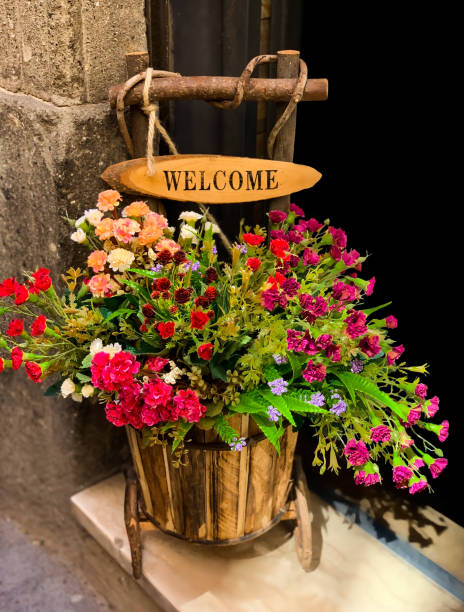 istock Colorful flowers in basket 1279997496