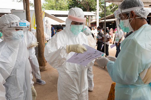 Mae Sot, Tak, Thailand - October 13, 2020 : Public Health Technical Officers collect secretions of Myanmar live in Mae Sot for COVID-19 testing at Pha Charoen Market, Mae Sot, Tak, Thailand.