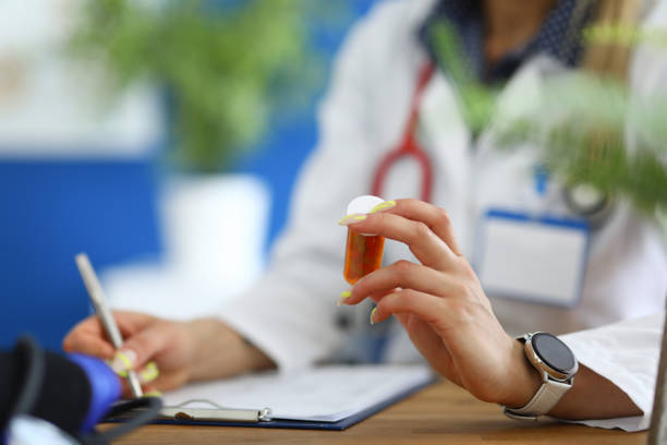 istock Doctor in white coat write prescription at clinic. 1280000435