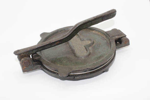 istock A picture of old and used roti maker on white background 1280000984