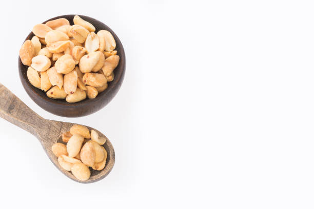 istock Organic peeled peanuts - Arachis hypogaea. Text space 1280002351