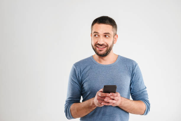 istock Cheerful man chatting by mobile phone. 1280005133