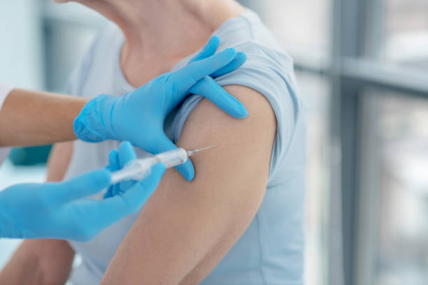 istock Close up picture of nurses hands making vaccination 1280005163