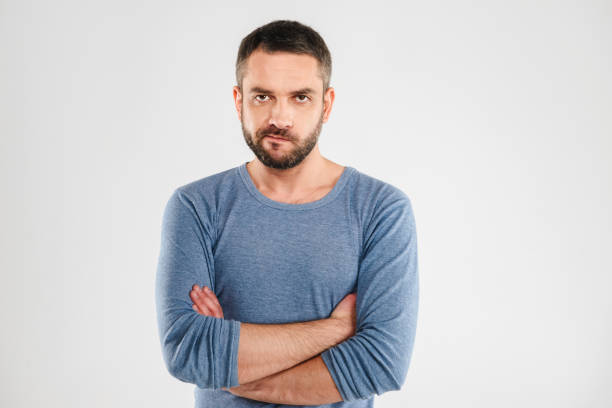 istock Angry displeased man standing isolated 1280005330