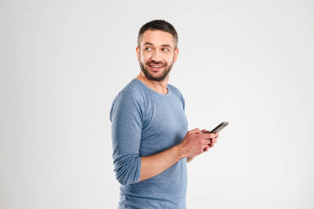 istock Cheerful man chatting by mobile phone. 1280005430