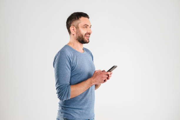 istock Happy man chatting by mobile phone. 1280005643
