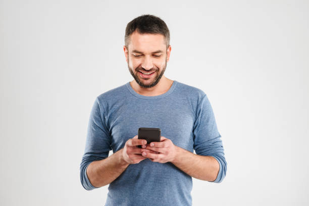 istock Cheerful man chatting by mobile phone. 1280006530