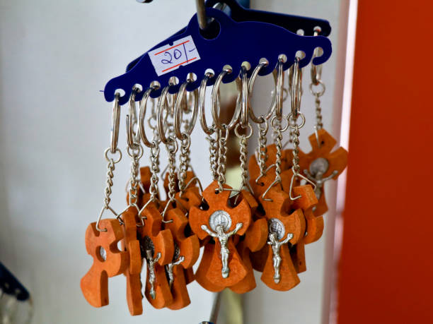 istock Key chains with catholic religious symbols in a pious articles shop 1280006990