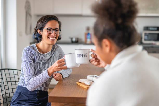 istock Multi Ethnic Female Friends Drinking Coffee In The Kitchen 1280007083