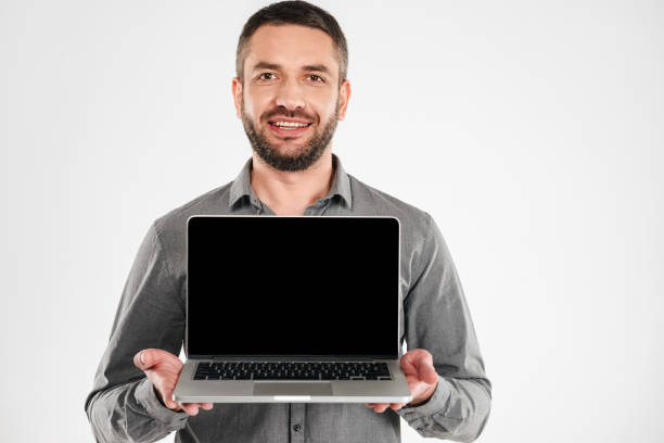 istock Businessman showing display of laptop computer. 1280008105