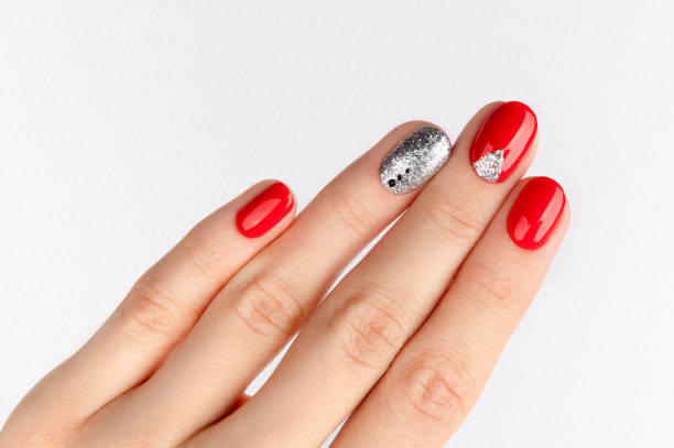 istock Womans hand with fashionable red manicure. 1280008934