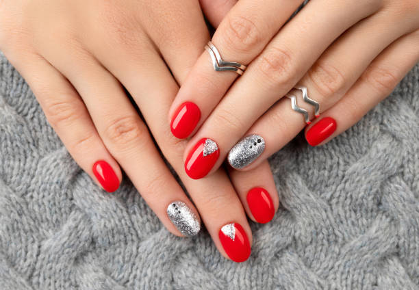 istock Womans hands with fashionable red manicure 1280009451