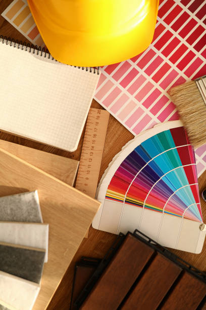 istock On table is hard hat, colorful palette with samples, ruler, wooden part and blanket. 1280009932