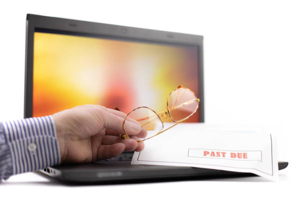 istock a notebook computer with a colorful display with man holding a a pair of reading glasses on the keyboard isolated on white 1280010112