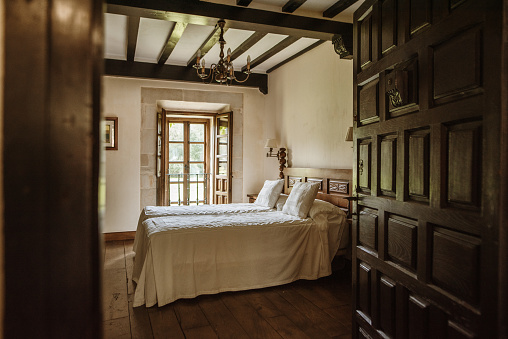 A vintage bedroom with wooden elements