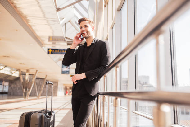 istock Man making a phone call from the airport 1280016907
