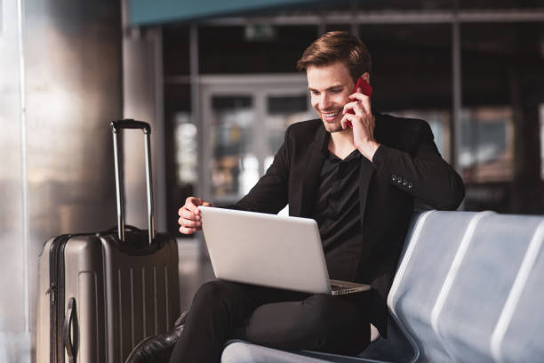 istock Man dealing with his working tasks in the airport 1280016945
