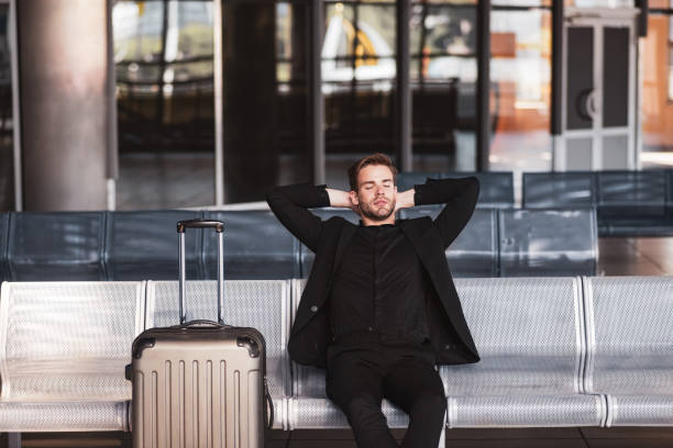 istock Man waiting for his flightin the airport 1280016957