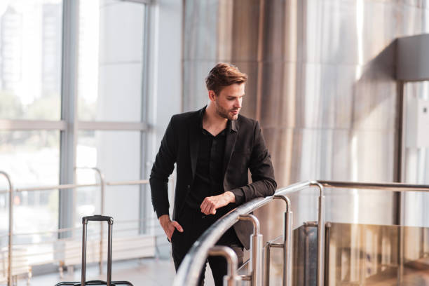 istock Man waiting for his flight at the airport 1280016964